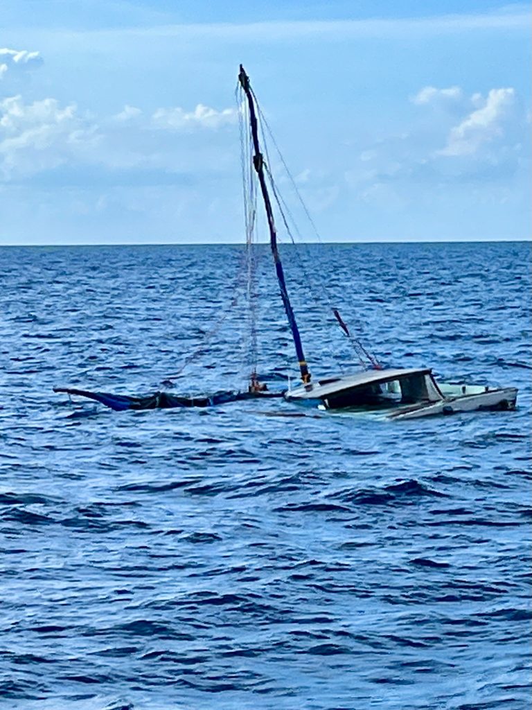 Half Sunken Haitian Refugee Boat