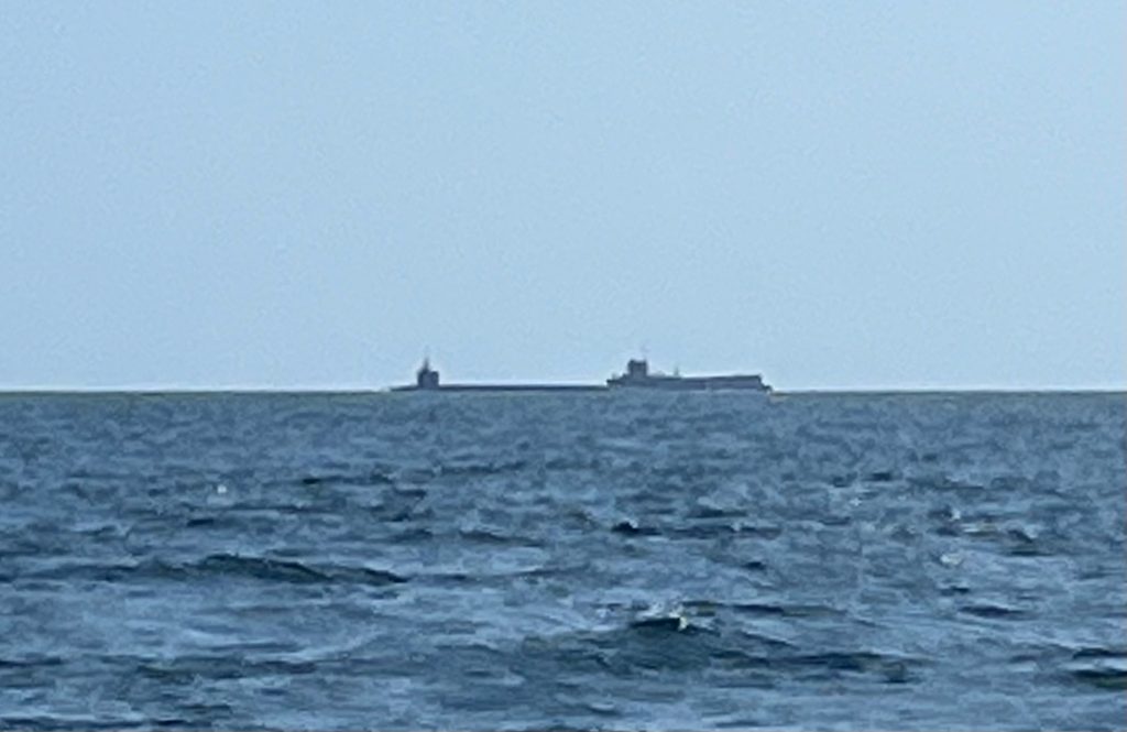 Submarine being escorted to deep water from the Naval Submarine Base Kings Bay, GA