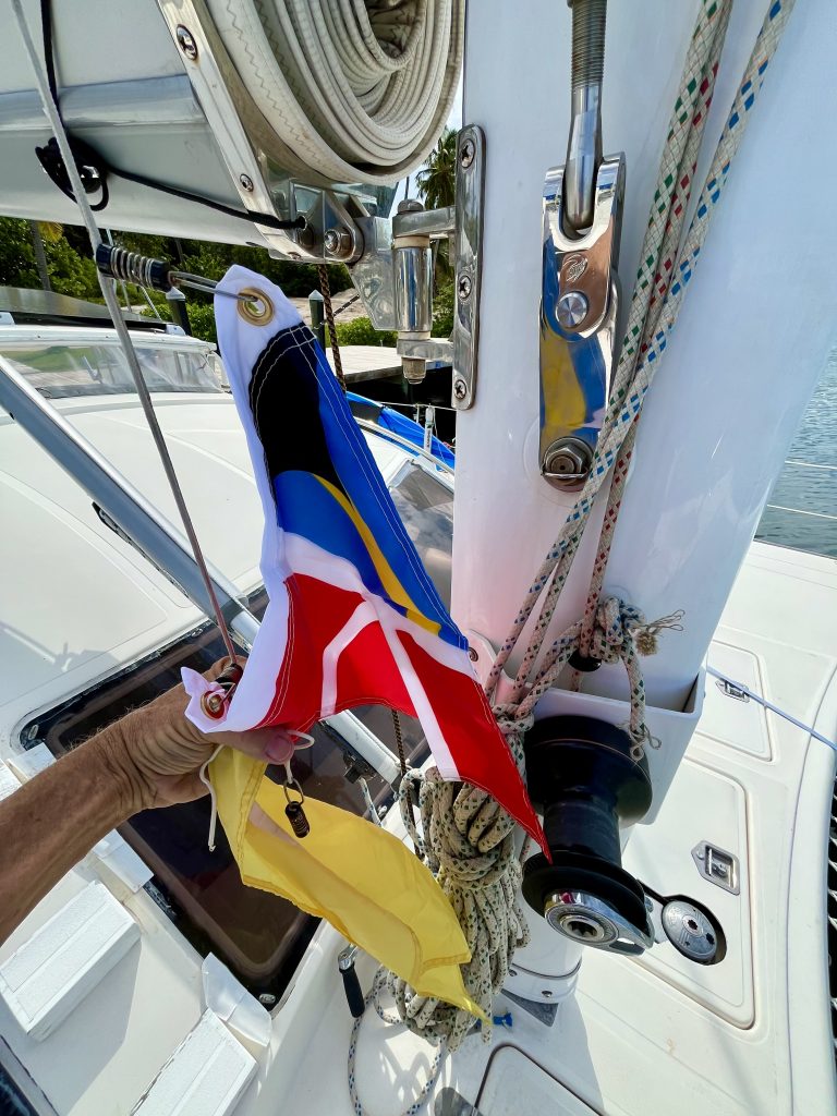 Down with the Q-Flag and Up With The Bahamas Courtesy Flag